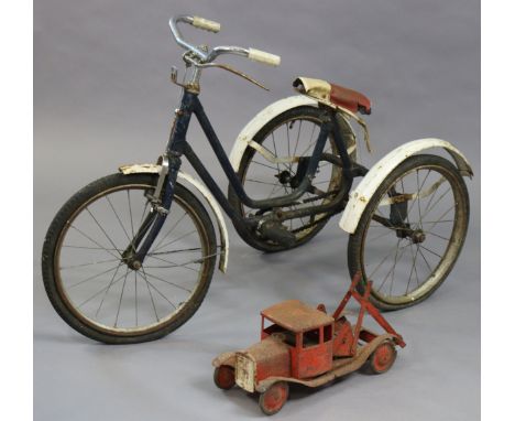 A mid-20th century child’s tricycle (blue); &amp; a triang-type model two-truck, 42cm long.