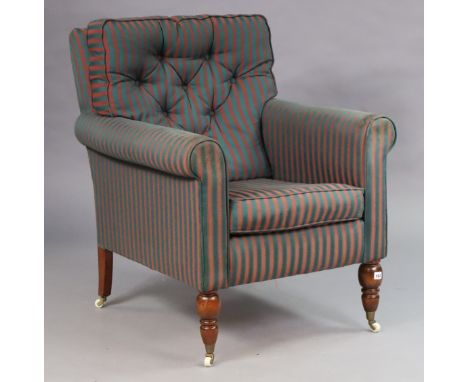 A Victorian-style square back armchair upholstered red &amp; blue stripped material, &amp; on turned legs with ceramic castor
