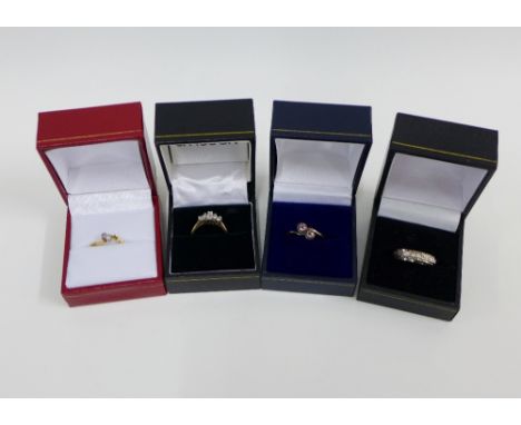 Four 9ct gold gemset rings to include an eternity ring (4)