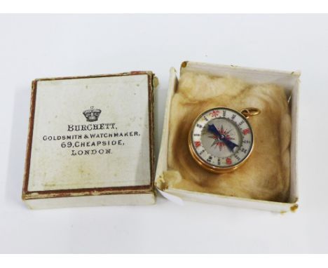 18ct gold mounted barometer and compass pendant, stamped 18ct, 3cm diameter, with a Burchett Goldsmiths &amp; Watchmakers, Ch