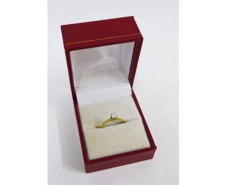 18ct gold diamond solitaire ring, approx 0.10ct, in a claw setting and plain band, fully hallmarked. 