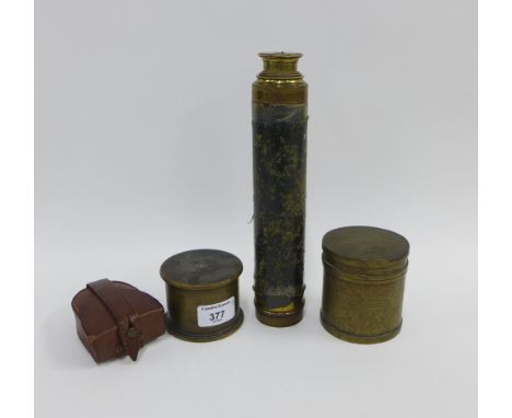Negretti and Zambra compass in a brown leather case, two trench art shell cases and a four drawer brass and leather telescope