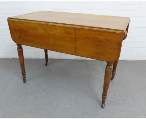 Victorian mahogany Pembroke table, on ring turned legs terminating on castors, 76 x 106cm