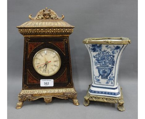 Modern mantle clock and blue and white vase on metal base, 920 