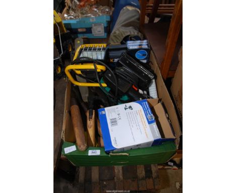 A box of exterior light, garden shears, leed lamp and security camera.