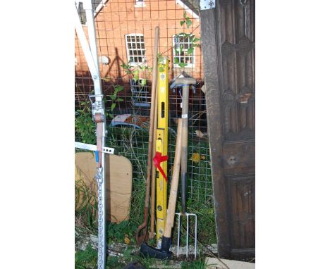 A stainless steel fork, log splitter (a/f), hoe, etc.