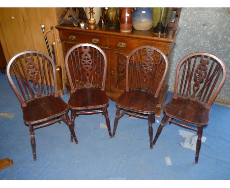 Four stick back kitchen chairs.