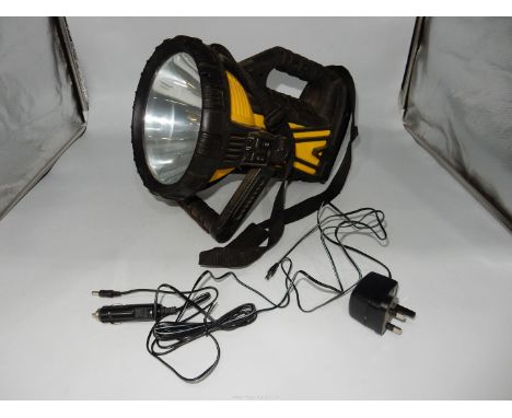 A large search-light style rechargeable torch with back-light, carrying sling, mains and car charging equipment. Appears to r
