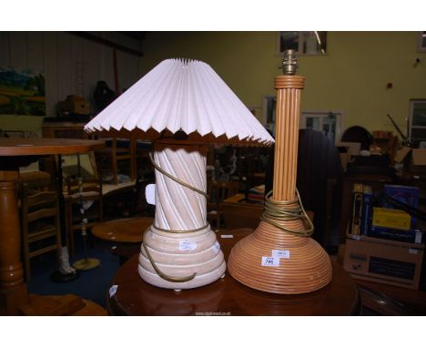 A woven bamboo/cane effect lamp base, and a table lamp with shade.