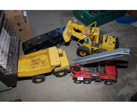 A Tonka tipper, a Meccano fire engine, car transporter etc.