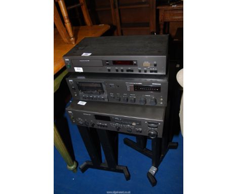 A NAD Hi-Fi separate including A7155 stereo receiver, a 6050C stereo cassette tape deck, and a 5325 compact disc player, with