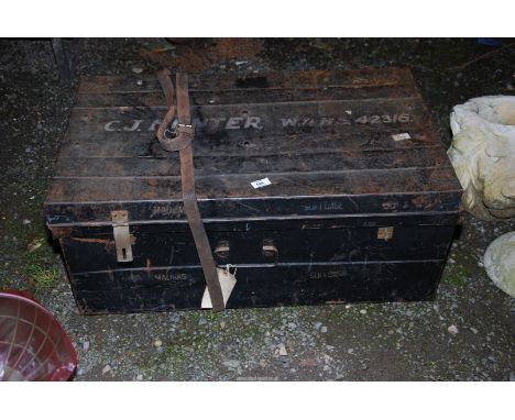A metal trunk marked C.J Hunter.