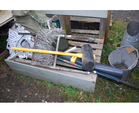 Galvanised wall ties, small galvanised ladder, damp proof, rake and large rubber mallet.