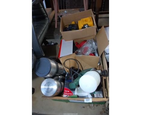 Two Thermos flasks, a Dewalt 18 volt charger and batteries, and an Oregon chainsaw sharpener.