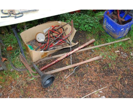 A box of jump leads, hedging bill, bow saw, nail bar etc.