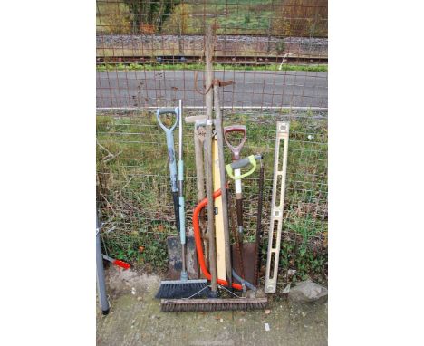 A spirit level, two bow saws, brushes, spade and shovel.