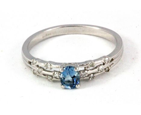 A 9ct white gold aquamarine and diamond set ring, (Q.5).