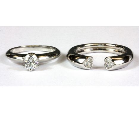 Two Tifffany &amp; Co 18ct white gold rings; an 0.51ct brilliant cut diamond set solitaire ring and a diamond set heart shape