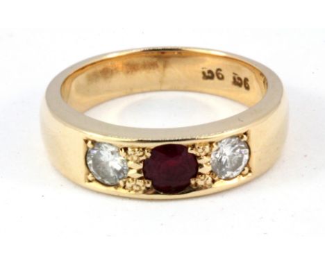 A heavy gentleman's 9ct yellow gold diamond and ruby set ring, (approx. 0.5ct diamond), (P).