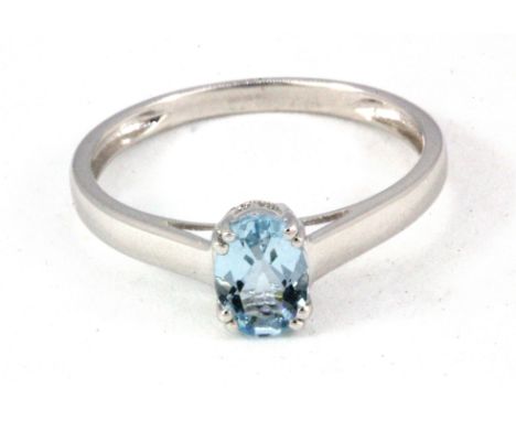 A 9ct white gold (stamped 9k) oval cut aquamarine set solitaire ring, (Q.5).