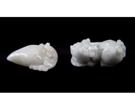 A Chinese carved liondog amulet with a carved jade peach, L. 5cm with the carved jade peach.