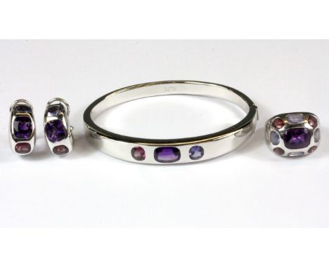 A Chanel suite of 18ct white gold pair of earrings, ring and bangle, set with amethyst, tourmaline and iolite, (K), bangle  i