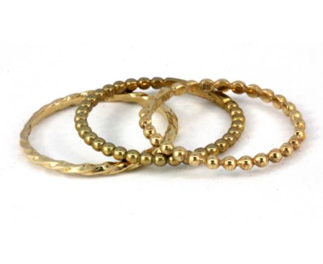 Two 10ct yellow gold (stamped 10k) patterned rings and a further 9ct gold ring, (Q).