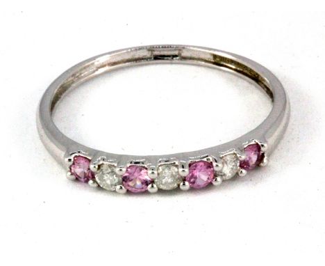 A 9ct white gold pink topaz and diamond set half eternity ring, (Q.5).