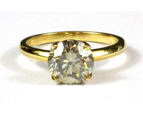 A 9ct yellow gold (stamped 375) solitaire ring set with a 2.6ct brilliant cut diamond.