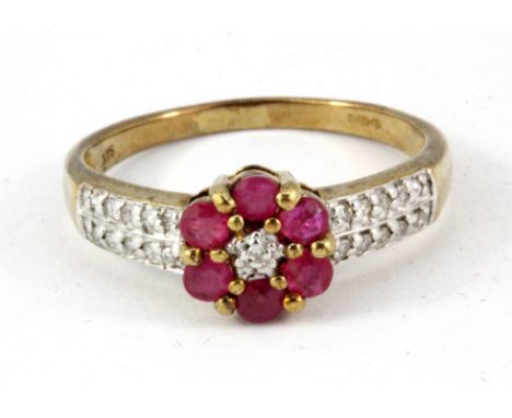 A 9ct yellow gold ruby and diamond set cluster ring, (N.5).