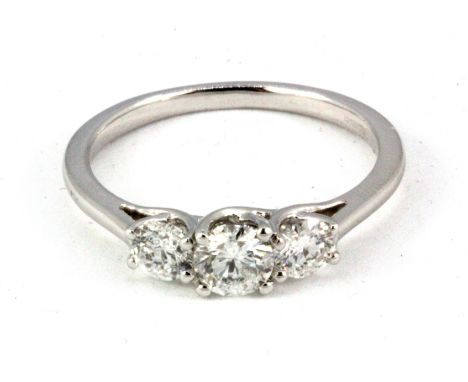 A 9ct white gold three diamond set ring, approx. 1ct overall, (Q.5).