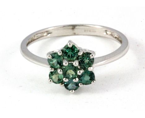 A 9ct white gold green topaz set cluster ring, (Q.5).