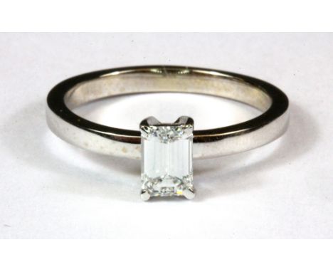 An 18ct white gold baguette cut diamond set solitaire ring, approx. 0.5ct, (M.5).