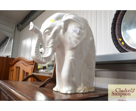 A white glazed planter in the form of an elephant AF