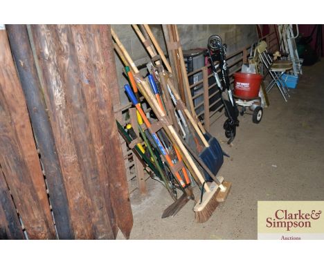 A quantity of long handled gardening tools