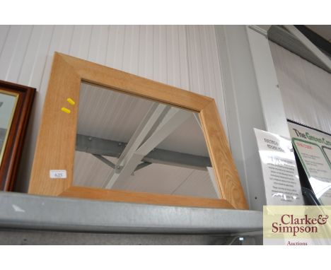 An oak framed mirror
