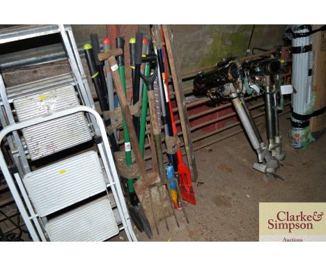 A quantity of long handled gardening tools