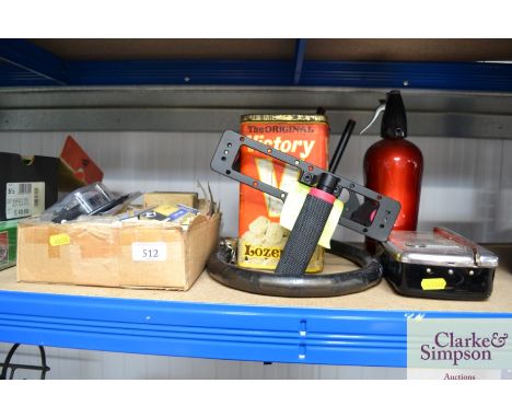 A box containing various phonograph stylus; soda siphon; camera case; vintage tin etc