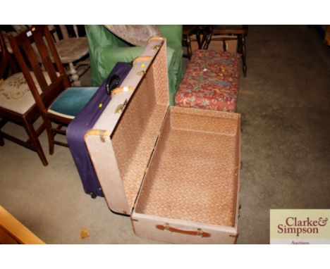 A wooden and metal bound travelling trunk and suitcase