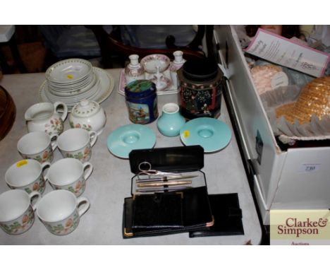 A quantity of dressing table china; oriental tin; a pair of Poole candle sticks; leather wallets; pens etc