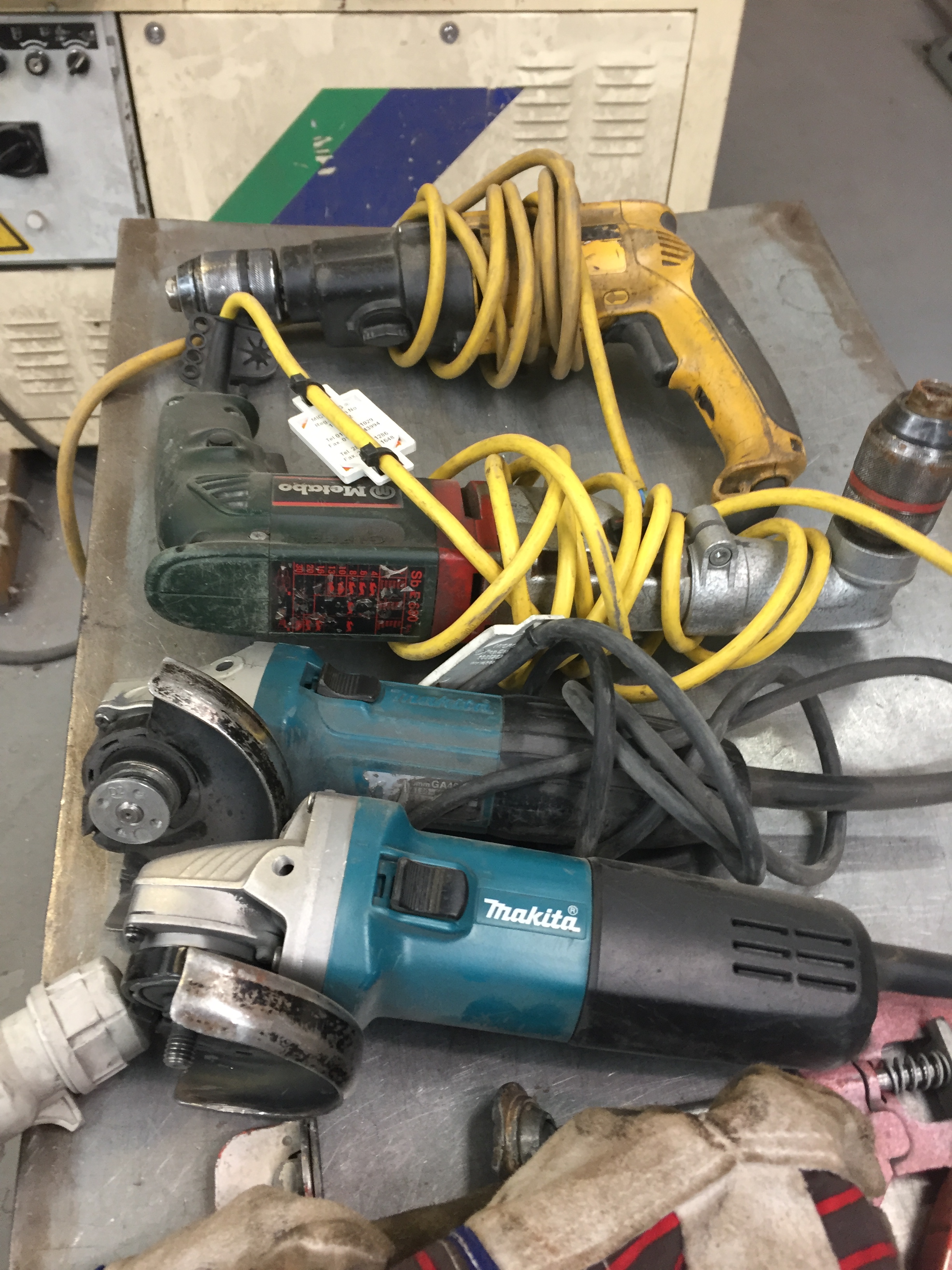 Three Makita Angle grinders (one spares), Qty sanding Discs, Metabo