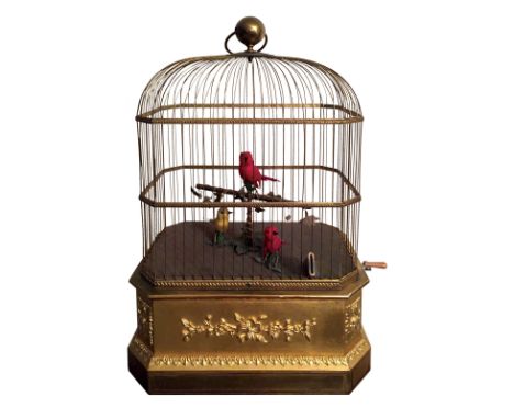 This beautiful bird cage with 3 singing birds from aprox. 1885 is very rare and has a coin operated mechanism to activate the