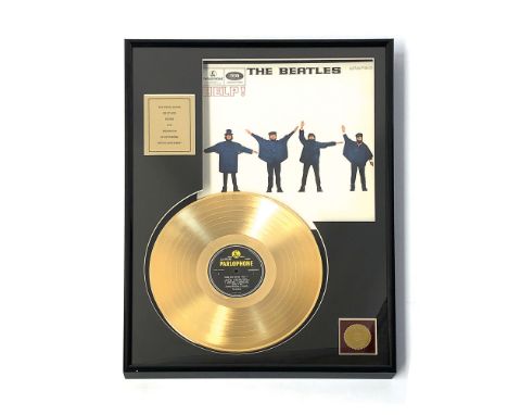 24 karat gold plated The Beatles "Help!" record in frame. Collector's item. Size: 61 x 46 cm. Condition: Excellent.