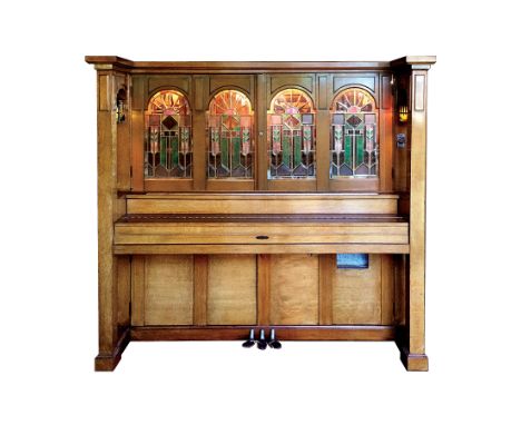 Cremona Orchestral K manufactured by Marquette Piano Company. It has beautiful beveled clear glass and Tiffany style art glas