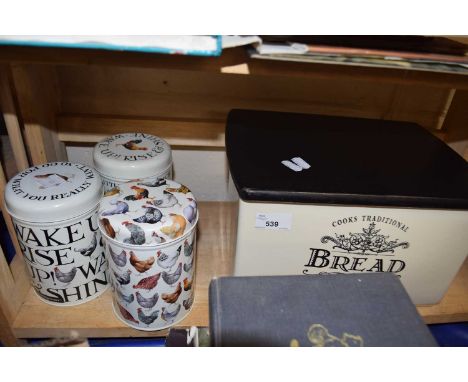 Three Emma Bridgewater storage tins together with a ceramic bread bin