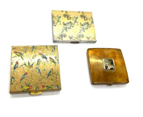 Three vintage compact cases includes Vogue etc 