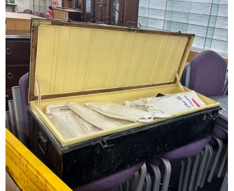 Vintage metal travel trunk with a large selection of assorted vintage and later shirts 