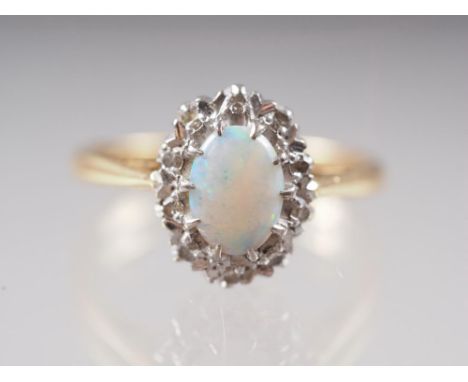 An 18ct gold, platinum, opal and diamond cluster ring, size I, 2.9g 