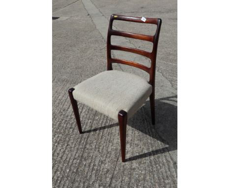 A set of eight D-Scan 1960s teak ladder back dining chairs with stuffed over seats, on turned and tapering supports 