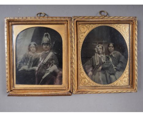 A mid 19th century Ambrotype, officer and wife, with gilt mounts and strip frame, and another similar